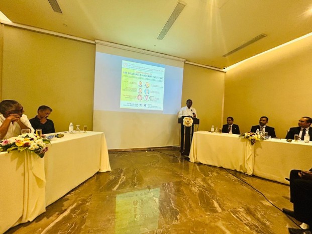 Panel and moderator at discussion table